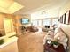 Open-concept living room with neutral decor, a ceiling fan, and ample seating space at 2707 Canvasback Trail, Myrtle Beach, SC 29588
