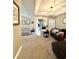 Open living room with carpet flooring, neutral walls, a ceiling fan, and a view of the hallway at 2707 Canvasback Trail, Myrtle Beach, SC 29588