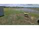 Large, fenced backyard with serene lake view and plenty of room to roam at 297 Harvest Ridge Way, Conway, SC 29527