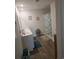 The bathroom has double sinks, a walk-in shower, wood-look flooring, and natural light at 297 Harvest Ridge Way, Conway, SC 29527
