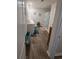The bathroom has double sinks, a walk-in shower, wood-look flooring, and natural light at 297 Harvest Ridge Way, Conway, SC 29527