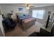 This bedroom features neutral walls, a ceiling fan, and a large window for plenty of natural light at 297 Harvest Ridge Way, Conway, SC 29527