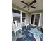 Inviting covered patio with stylish ceiling fan, window, and sliding glass doors to the house at 297 Harvest Ridge Way, Conway, SC 29527