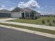 Charming single-story home with a well-manicured lawn and attached two-car garage in a residential community at 297 Harvest Ridge Way, Conway, SC 29527