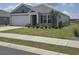 Charming single-story home with a well-manicured lawn and attached two-car garage in a residential community at 297 Harvest Ridge Way, Conway, SC 29527
