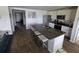 Modern kitchen with a large island, stainless steel appliances, white cabinets, and hard surface countertops at 297 Harvest Ridge Way, Conway, SC 29527