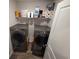 Convenient laundry room featuring modern side-by-side washer and dryer units with ample storage space at 297 Harvest Ridge Way, Conway, SC 29527