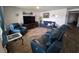 Cozy living room with a large television, comfortable seating, and stylish decor at 297 Harvest Ridge Way, Conway, SC 29527