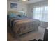 Bedroom featuring a large bed with decorative pillows and a window with natural light at 297 Harvest Ridge Way, Conway, SC 29527