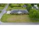 Aerial view showcases the property with a well-kept lawn and mature trees at 316 Oliver St., Marion, SC 29571