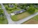 Aerial view of a brick home featuring a well-maintained lawn and mature landscaping at 316 Oliver St., Marion, SC 29571