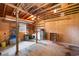 Unfinished basement with wood framing, pegboard walls, and utility sink at 316 Oliver St., Marion, SC 29571