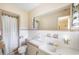 Classic bathroom with tiled walls, a large mirror, and a shower with white curtain at 316 Oliver St., Marion, SC 29571