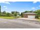 Property featuring a detached garage with an asphalt driveway, side yard, and chain link fence at 316 Oliver St., Marion, SC 29571
