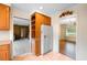 Bright kitchen featuring tile flooring, wooden cabinets, and modern white refrigerator at 316 Oliver St., Marion, SC 29571