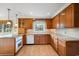 Spacious kitchen boasting tile floors, granite counters, and wooden cabinetry at 316 Oliver St., Marion, SC 29571