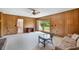 Inviting living room with wood-paneled walls, glass doors, and natural light at 316 Oliver St., Marion, SC 29571
