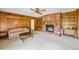 Spacious living room with fireplace, built-in shelving, and paneled walls at 316 Oliver St., Marion, SC 29571