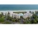 Aerial view of oceanfront condos with a pool, beautiful landscaping and beach access at 341 South Dunes Dr. # C-34, Pawleys Island, SC 29585