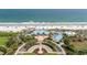 Beachfront clubhouse with a dining terrace and beach access on a manicured lawn at 341 South Dunes Dr. # C-34, Pawleys Island, SC 29585