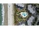 Aerial view of an oceanfront community with a pool, boardwalk, and beach at 341 South Dunes Dr. # C-34, Pawleys Island, SC 29585