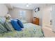 Comfortable bedroom showcasing twin beds, a wooden dresser, and a wall-mounted TV for relaxing evenings at 341 South Dunes Dr. # C-34, Pawleys Island, SC 29585