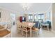 Dining room with an ocean view, modern lighting, and an open floor plan at 341 South Dunes Dr. # C-34, Pawleys Island, SC 29585