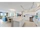 Open kitchen with white cabinetry, stainless appliances, and bar seating at 341 South Dunes Dr. # C-34, Pawleys Island, SC 29585