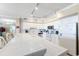 Bright kitchen with white cabinets, track lighting, and a spacious tile-topped island at 341 South Dunes Dr. # C-34, Pawleys Island, SC 29585