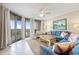 Bright living room featuring tile floors, a ceiling fan and ocean view balcony access at 341 South Dunes Dr. # C-34, Pawleys Island, SC 29585