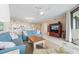 Comfortable living room with open floorplan to dining and kitchen area at 341 South Dunes Dr. # C-34, Pawleys Island, SC 29585