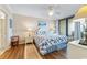 Cozy main bedroom with access to a private balcony, decorated in calming blue tones at 341 South Dunes Dr. # C-34, Pawleys Island, SC 29585