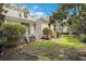 Charming backyard with lush lawn and a home with white trim and stairs at 346 Tuckers Rd. # A, Pawleys Island, SC 29585