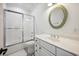 Modern bathroom with white fixtures, patterned tile floor, and glass-enclosed shower at 346 Tuckers Rd. # A, Pawleys Island, SC 29585