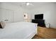 Cozy bedroom with white walls, contrasting dark dresser, and plush bedding at 346 Tuckers Rd. # A, Pawleys Island, SC 29585
