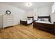 Charming bedroom with twin beds, hardwood floors, and a bright, inviting atmosphere at 346 Tuckers Rd. # A, Pawleys Island, SC 29585