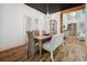 Charming dining room with a wooden table, wicker chairs, and views into the kitchen at 346 Tuckers Rd. # A, Pawleys Island, SC 29585