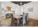 Open concept dining area leading to a stylish kitchen with bright lighting and modern furniture at 346 Tuckers Rd. # A, Pawleys Island, SC 29585