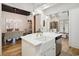 Bright kitchen with hardwood floors, white cabinets, stainless steel appliances, and white countertops at 346 Tuckers Rd. # A, Pawleys Island, SC 29585