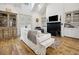 Elegant living room with a vaulted ceiling, fireplace, and comfortable seating arrangement at 346 Tuckers Rd. # A, Pawleys Island, SC 29585
