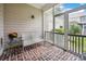 Enclosed porch featuring brick flooring and comfortable seating, perfect for relaxation at 346 Tuckers Rd. # A, Pawleys Island, SC 29585