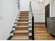 Stairway features modern railings and carpeted steps leading to the upper level at 346 Tuckers Rd. # A, Pawleys Island, SC 29585