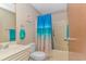 Clean and functional bathroom with a toilet, vanity, mirror, and a shower/tub with a beach-themed curtain at 3700 Golf Colony Lane # 20-L, Little River, SC 29566