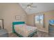 Cozy bedroom features a vaulted ceiling, wood floors, and a large window for plenty of natural light at 3700 Golf Colony Lane # 20-L, Little River, SC 29566