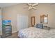 Comfortable bedroom includes wood floors, beach themed decor, and a closet at 3700 Golf Colony Lane # 20-L, Little River, SC 29566
