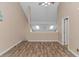 Bonus Room with vaulted ceilings, hardwood flooring and a view of the loft above at 3700 Golf Colony Lane # 20-L, Little River, SC 29566