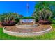 The Golf Colony Resort community sign is surrounded by manicured landscaping and an American flag at 3700 Golf Colony Lane # 20-L, Little River, SC 29566