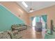 Living room featuring vaulted ceilings, skylights, sliding glass doors and vinyl floors at 3700 Golf Colony Lane # 20-L, Little River, SC 29566