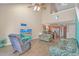 Open-concept living room boasts vaulted ceilings, wood floors, and seamless flow to the adjacent kitchen at 3700 Golf Colony Lane # 20-L, Little River, SC 29566