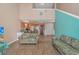 Inviting living room featuring vaulted ceilings, wood floors, and a view of the kitchen and upstairs loft at 3700 Golf Colony Lane # 20-L, Little River, SC 29566